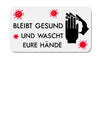 Es ist ein weißer Aufkleber auf weißem Hintergrund zu sehen. Auf dem Aufkleber sind rechts zwei Hände abgebildet die sich gerade die Hände einseifen. In der Mitte steht der Text: Bleibt Gesund Und Wascht Eure Hände. Rundherum sind 4 pinkfarbene Symbole für Corona-Viren abgebildet.